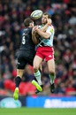 Alex Goode of Saracens and Harlequins' Nick Evans compete for a high ball