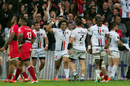 Toulouse players celebrate scoring a try