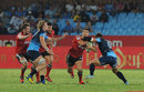 Dan Carter of Crusaders is tackled by Jacques Engelbrecht and Deon Stegman
