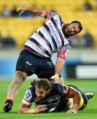 The Rebels' Laurie Weeks is hit by some friendly fire, Hurricanes v Rebels, Wellington, March 27, 2015