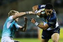 The Brumbies' Christian Leali'ifano breaks the Cheetahs' defence