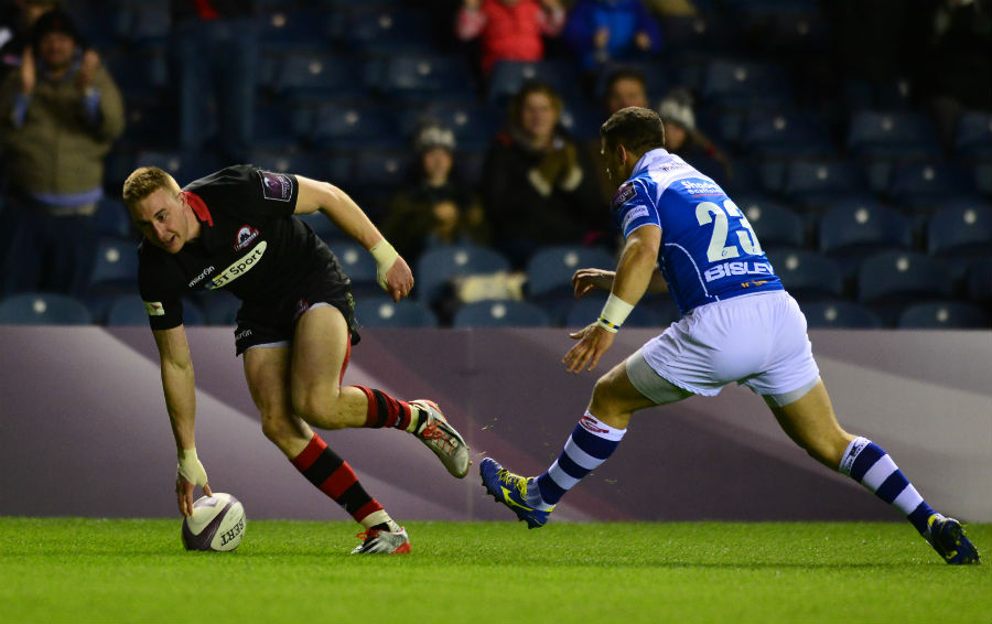 Dougie Fife of Edinburgh Rugby scores a try