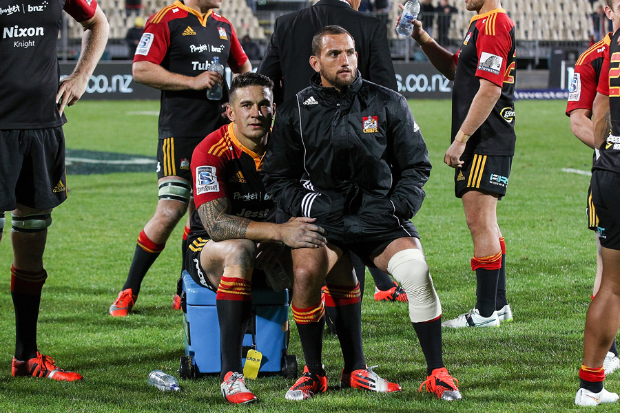 The Chiefs' Sonny Bill Williams and Aaron Cruden sit on the sidelines