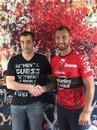 Quade Cooper shakes hands with Toulon club owner Mourad Boudjellal in a Toulon jersey