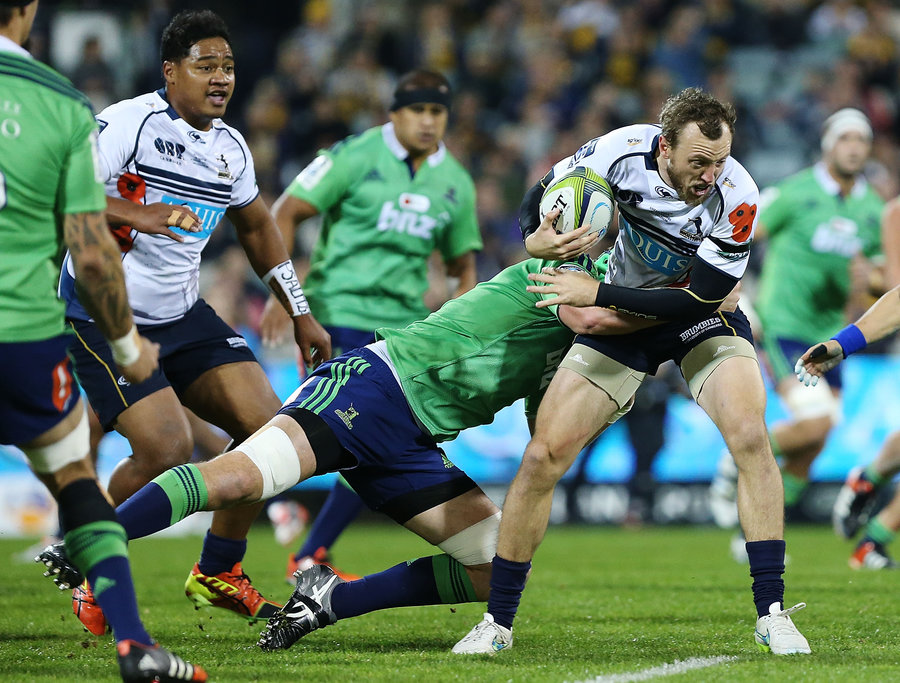 Jesse Mogg of the Brumbies takes on the Highlanders defence