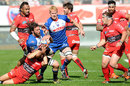 Grenoble's Peter Kimlin (C) looms up in support