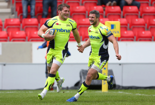 SALFORD, ENGLAND - MAY 9: Mark Cueto of Sale Sharks celebrates with team mate Tom Brady as he crosses the line to score a try during the Aviva Premiership match between Sale Sharks and Newcastle Falcons at the AJ Bell Stadium on May 9, 2015 in Salford, England. (Photo by Dave Thompson/Getty Images)