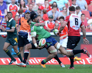 Nasi Manu of the Highlanders is taken high by the Lions defence, Lions v Highlanders, Super Rugby, Emirates Airline Park, May 9, 2015