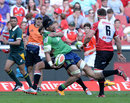 Nasi Manu of the Highlanders is taken high by the Lions defence