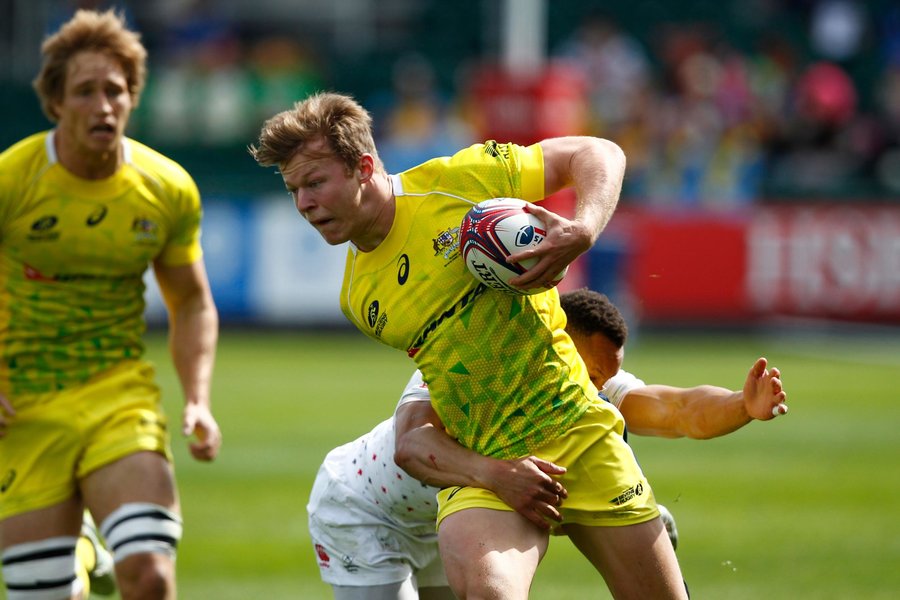 Australia's Cam Clarke is tackled by the England defence