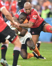 Raymond Rhule of the Cheetahs is taken high by the Lions defence