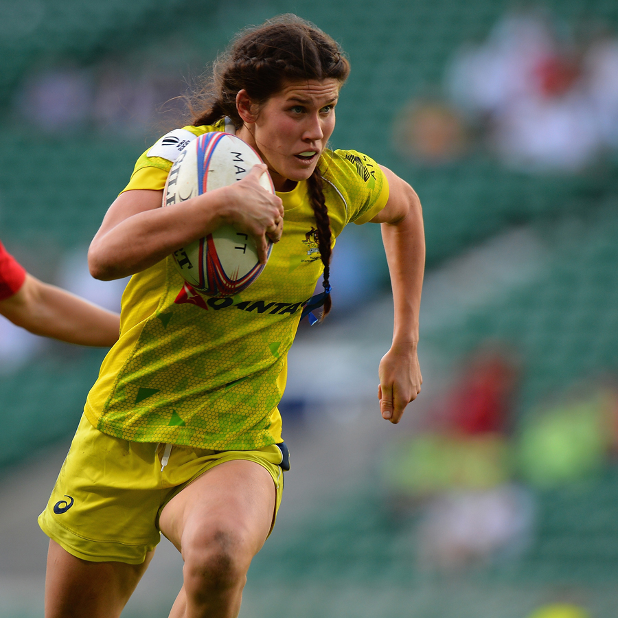 Australia's Charlotte Caslick runs the ball