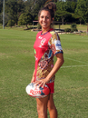 Queensland Women's Sevens player Talisha Harden models the unique jumper with which the Reds will mark National Reconciliation Week