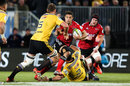 Crusaders' Dan Carter takes on the Hurricanes' defence