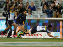 Brumbies' Jordan Smiler dives over the whitewash for his first Super Rugby try