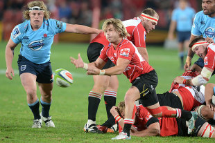 The Lions' Faf de Klerk clears the ball from a ruck, Lions v Waratahs, Johannesburg, May 30, 2015