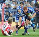Steven Kitshoff of the Stormers palms off Alwyn Hollenbach of the Lions