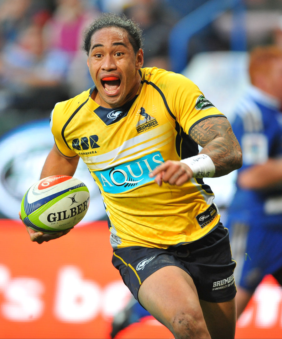 Joe Tomane of the Brumbies smiles as he runs in his third try of the match