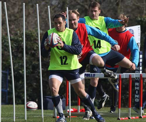 Centre Riki Flutey in action during an England training session