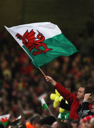 A Welsh fan waves a flag at the Millennium Stadium, Wales v France, Six Nations Championship, Millennium Stadium, Cardiff, March 15, 2008