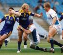 Jason Shoemark of the Highlanders is tackled