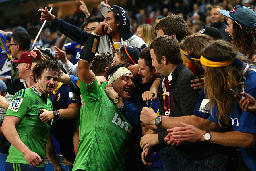 The Highlanders' Ash Dixon and Richard Buckman celebrate victory with fans