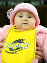 A young Hurricanes fan shows her colours - or at least the colours of her parents