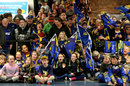 Highlanders supporters await their team's arrival at Dunedin Airport