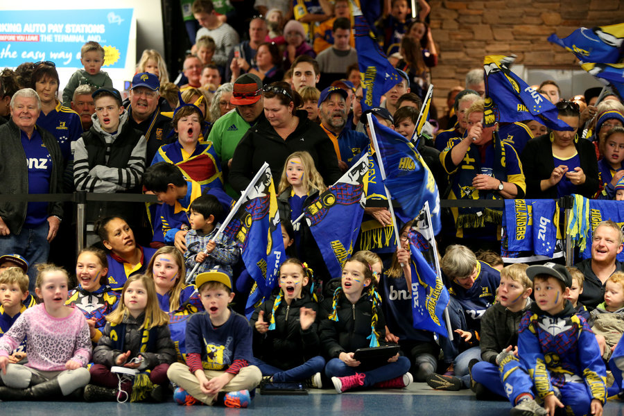 Highlanders supporters await their team's arrival at Dunedin Airport
