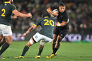 New Zealand's Lima Sopoaga takes he ball into contact