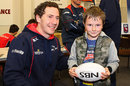 Tasman's Marty Banks poses with a young fan at the Makos' family fun day 