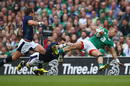 Simon Zebo of Ireland is tackled by Sean Lamont of Scotland