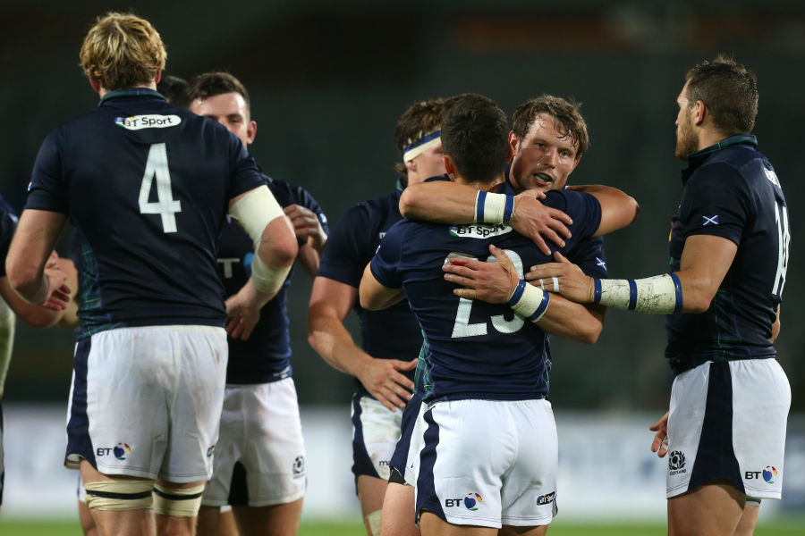 Scotland's players celebrate after beating Italy in a World Cup warm-up match