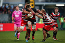 Luke Whitelock of Canterbury is tackled by Counties defence