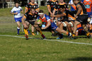 Cohen Masson of Greater Sydney Rams dives over for a try