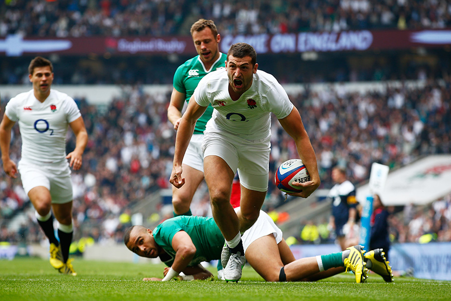 Jonny May of England celebrates scoring the first try