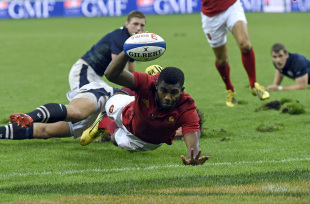 France's winger Noa Nakaitaci scores a try  during the rugby union test match between France and Scotland at the Stade de France in Saint-Denis, north of Paris, on August 5, 2015. AFP PHOTO / LOIC VENANCE        