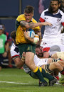 Australia's Sean McMahon is tackled by the USA Eagles' defence