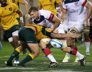 Luis Stanfill of the United States Eagles fumbles the ball as he is hit by Sean McMahon of the Australia Wallabies, United States v Australia, Soldier Field, Chicago, September 5, 2015