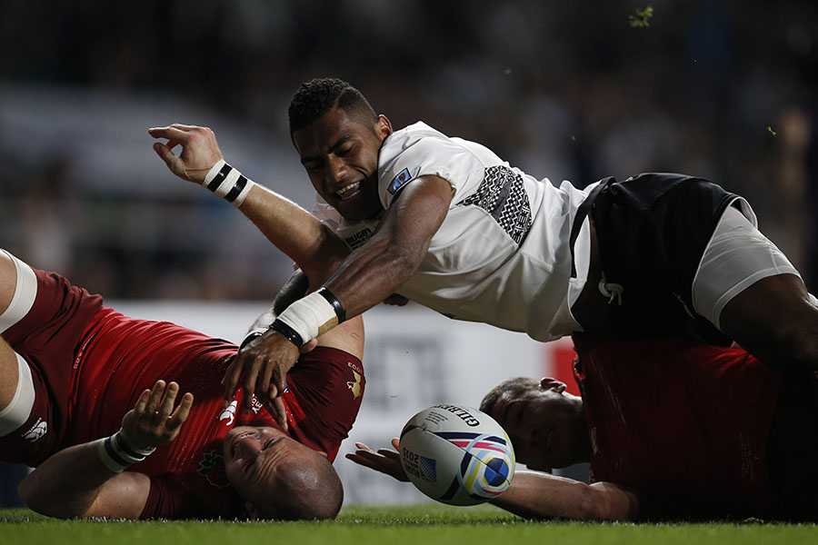 Fiji's scrum-half Nikola Matawalu (C) loses control of the ball and fails to score a try next to England's fullback Mike Brown (L) during a Pool A match of the 2015 Rugby World Cup between England and Fiji at Twickenham stadium in south west London on September 18, 2015.