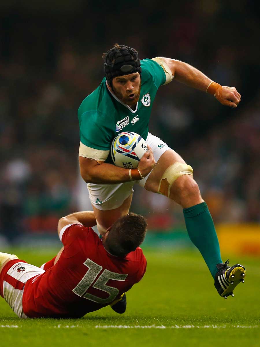 Ireland's Sean O'Brien breaks the tackle of Matt Evans