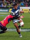 Auckland's Charles Piutau takes a tackle