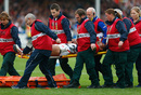 Amanaki Mafi is carried off on a stretcher