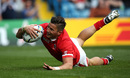 D.T.H van der Merwe of Canada goes over for the opening try 