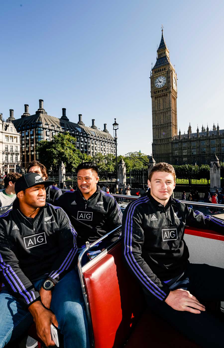 New Zealand's Waisake Naholo, Keven Mealamu and Beauden Barrett enjoy an open-top bus tour with sponsor AIG,