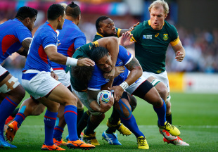 BIRMINGHAM, ENGLAND - SEPTEMBER 26: Alesana Tuilagi of Samoa is held up by the South Africa defence during the 2015 Rugby World Cup Pool B match between South Africa and Samoa at Villa Park on September 26, 2015 in Birmingham, United Kingdom.  (Photo by Laurence Griffiths/Getty Images)