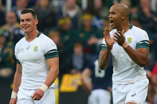 NEWCASTLE UPON TYNE, ENGLAND - OCTOBER 03:  JP Pietersen of South Africa (R) celebrates scoring a try with Fourie Du Preez of South Africa  during the 2015 Rugby World Cup Pool B match between South Africa and Scotland at St James' Park on October 3, 2015 in Newcastle upon Tyne, United Kingdom.  (Photo by Alex Livesey/Getty Images)