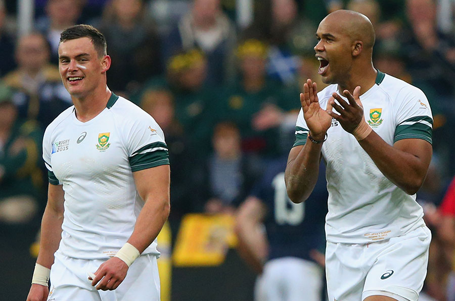 JP Pietersen of South Africa (R) celebrates scoring a try with Fourie Du Preez 