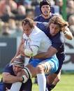 Italy's Sergio Parisse looks to get away from Fabien Barcella and Dimitri Szarzewski of France