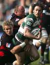 Julien Dupuy of Leicester Tigers is tackled by Justin Marshall of Saracens